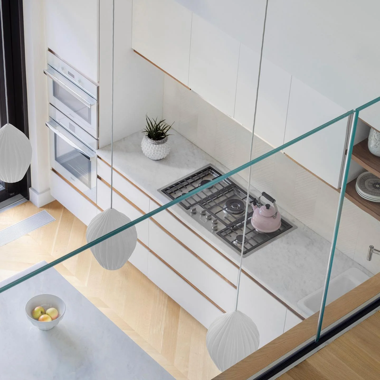Double-height kitchen, view from balcony above.