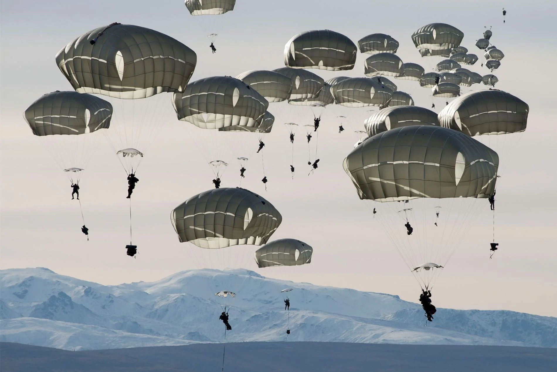 U.S. soldiers drop over the Donnelly Training Area near Fort Greely, Alaska. photo by Louie Palu .