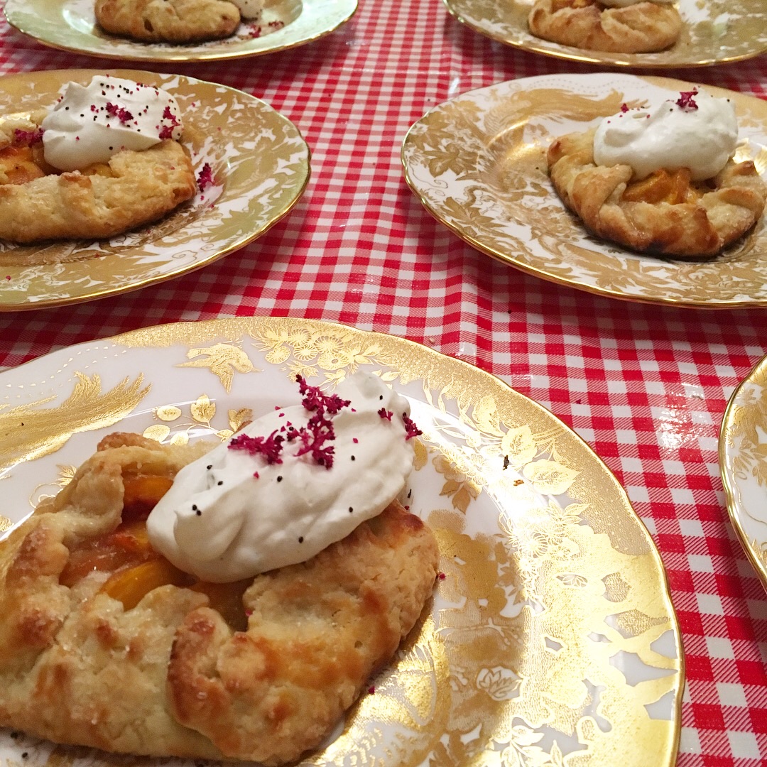peach galettes with cardamom whipped cream and amarnyth blooms
