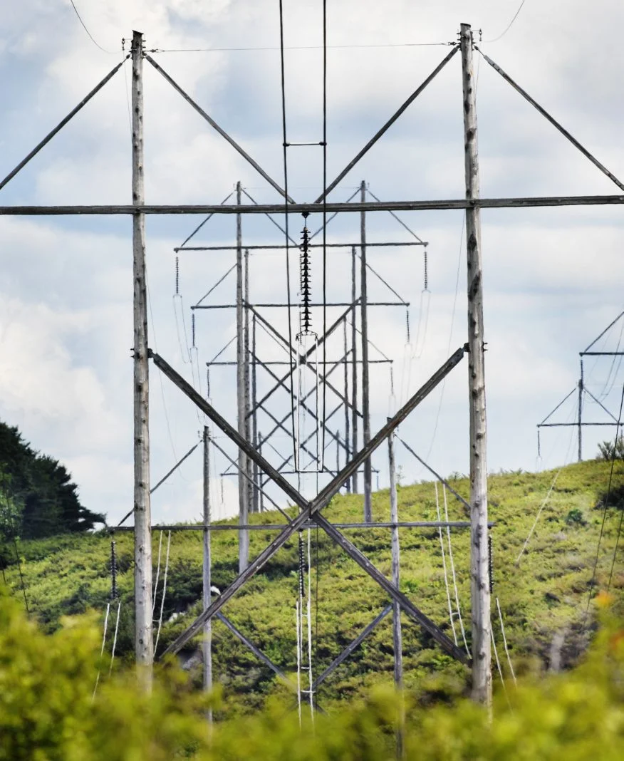 Transmission towers through a clearcut (credit: Portland Press Herald)