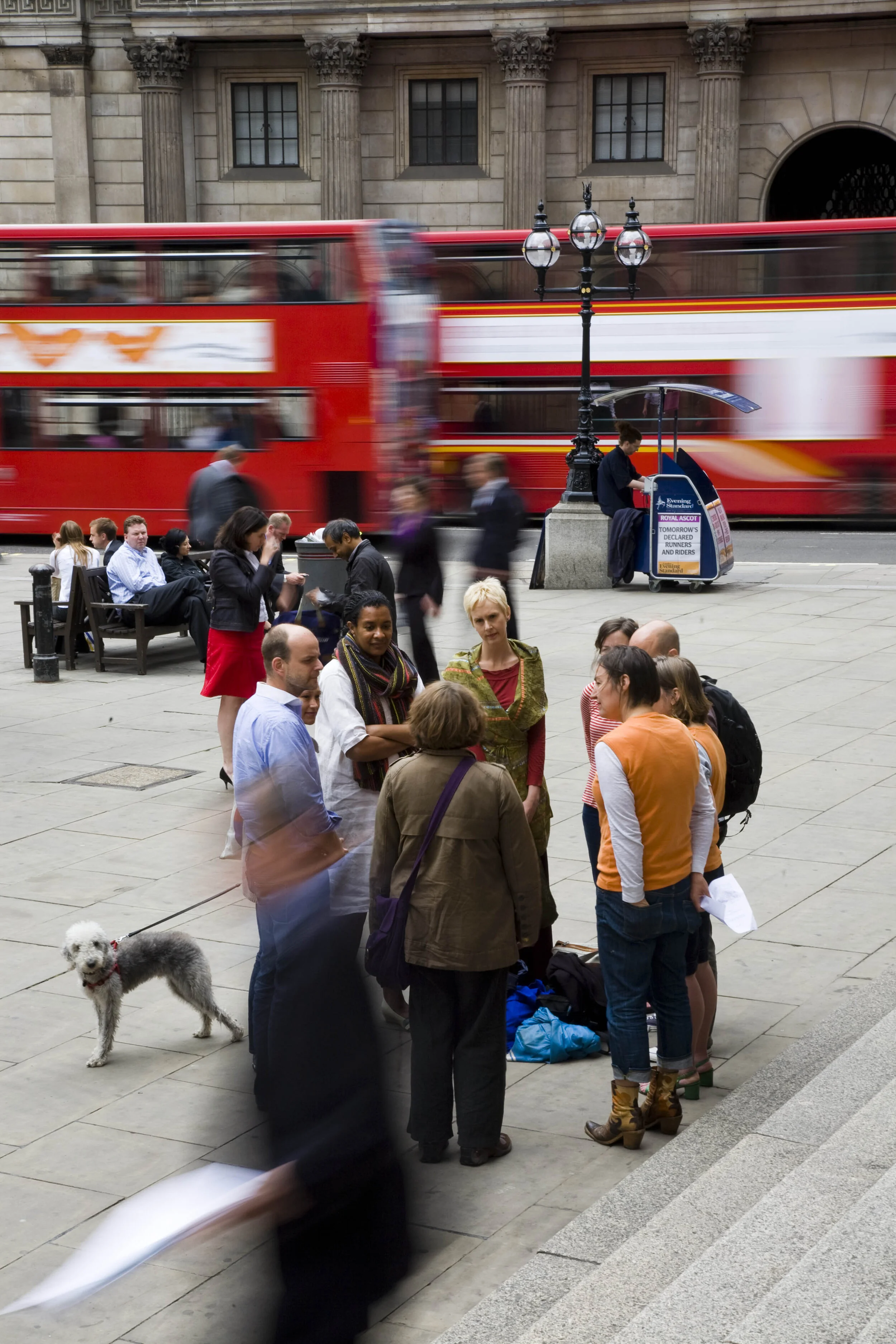 A circle of people listen to a speaker outside the Bank of England