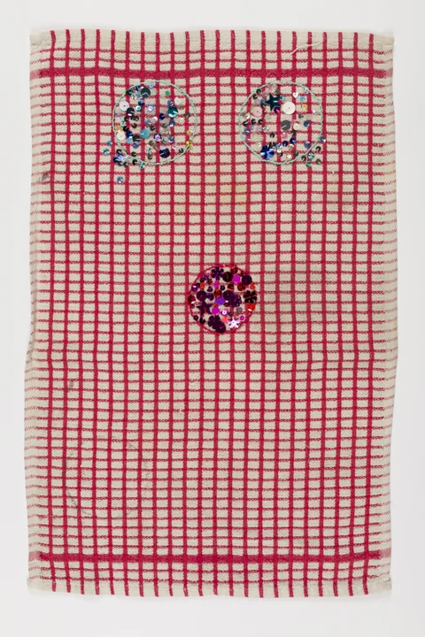 Used red and white dishcloth with the suggestion of a face