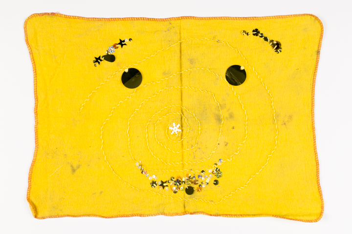 Used yellow dishcloth with the suggestion of a face