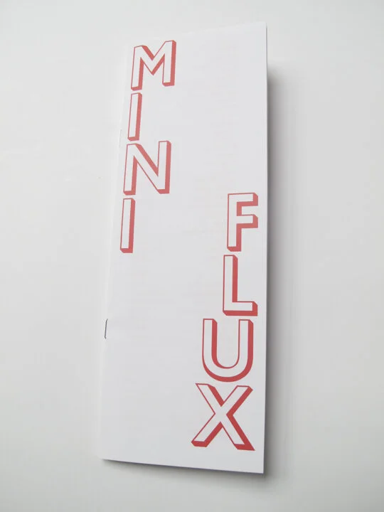 A tall narrow publication with the words Mini Flux on the cover