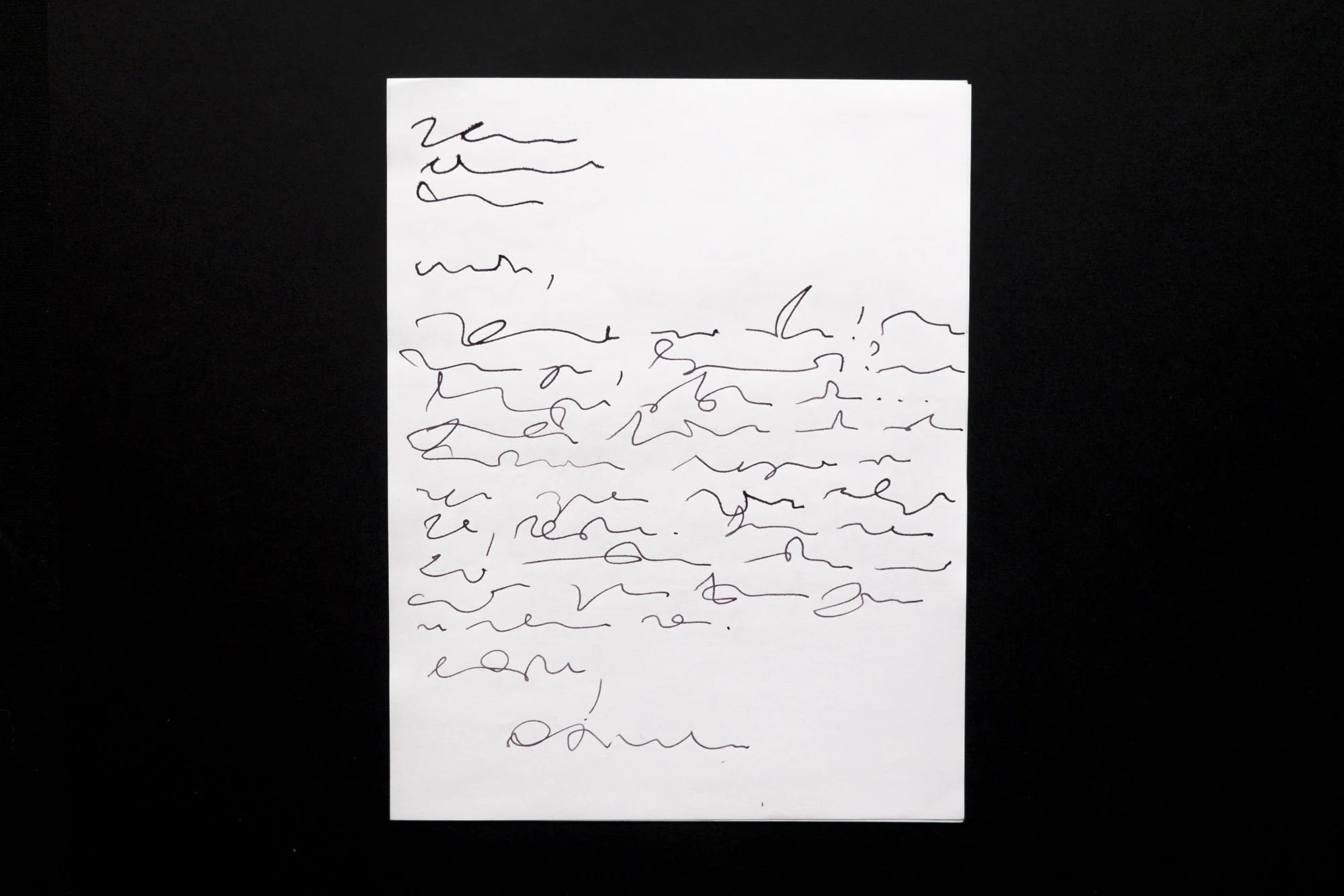 Black ink on paper that appears to be a handwritten letter but that is completely illegible