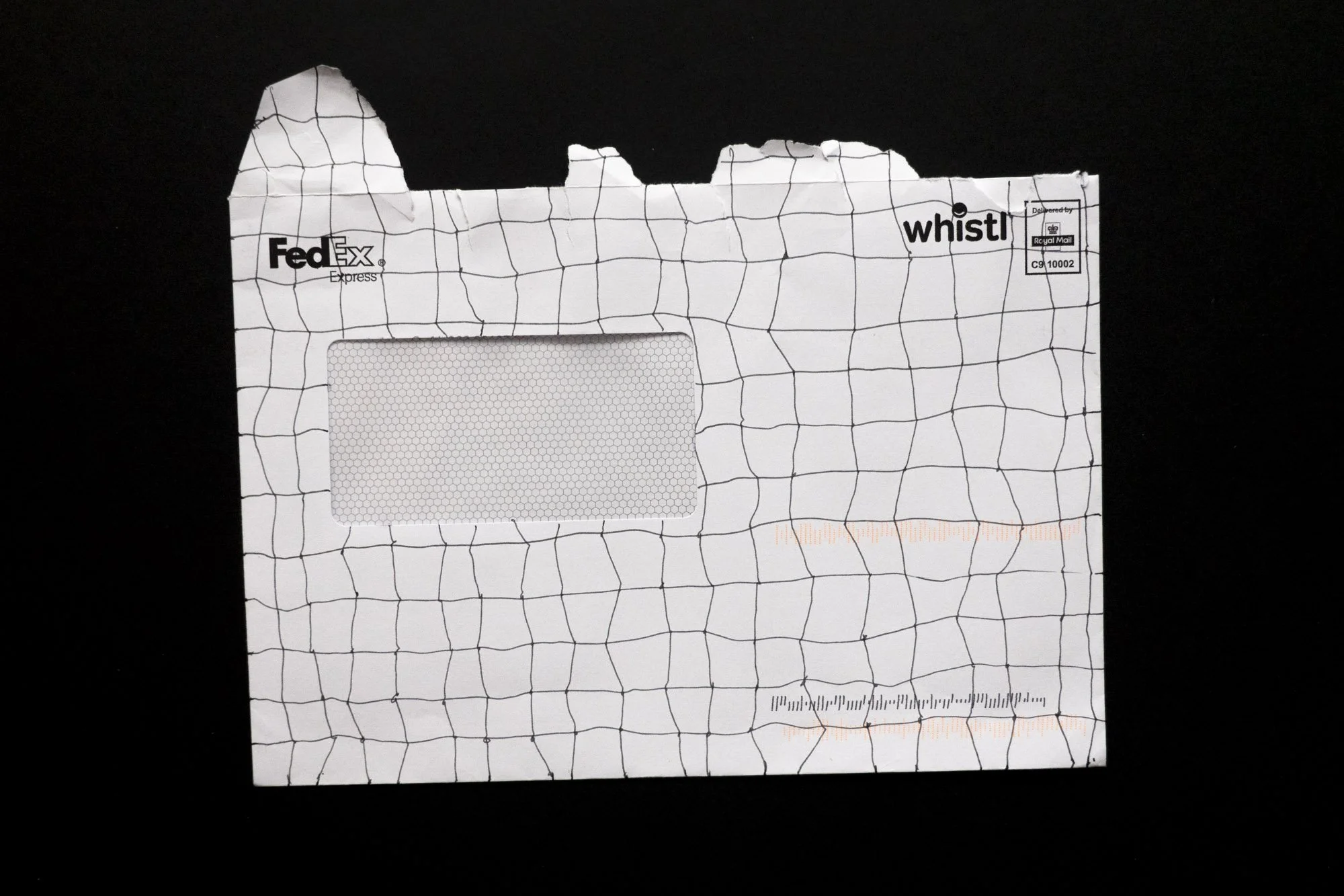 A white window envelope covered in a grid of hand-drawn lines