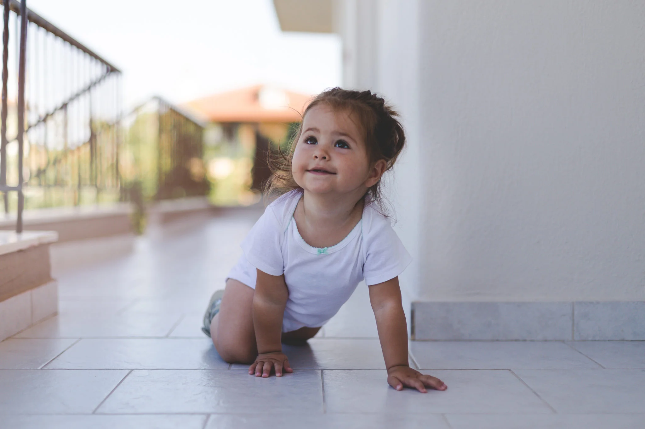 baby on tile exterior patio