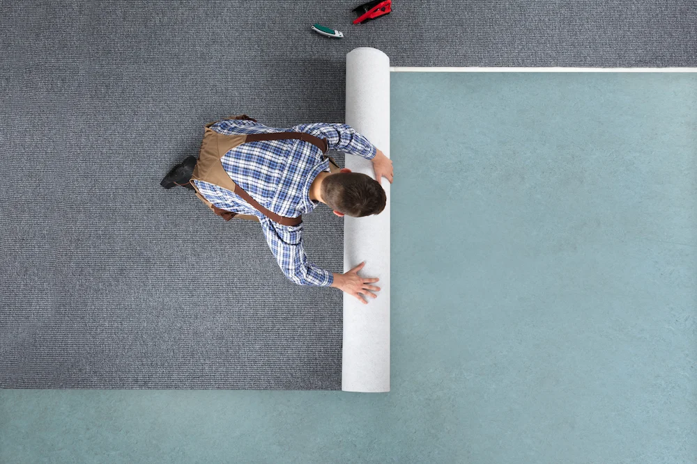 rolling-out-natural-and-organic-carpet-that-is-brand-new-from-above.jpg