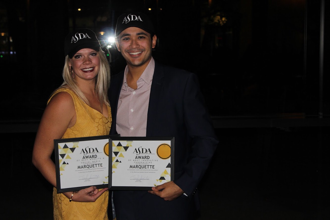 Angela Schmidt (Social Media Chair) and Jesus Echezerreta (Treasurer) with Marquette’s District awards