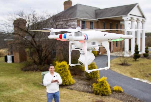 real-estate-agent-operating-a-DJI-phantom-camera-drone.jpeg