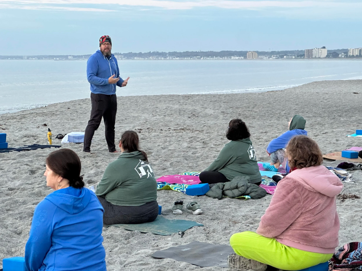 chris teaching on beach.png