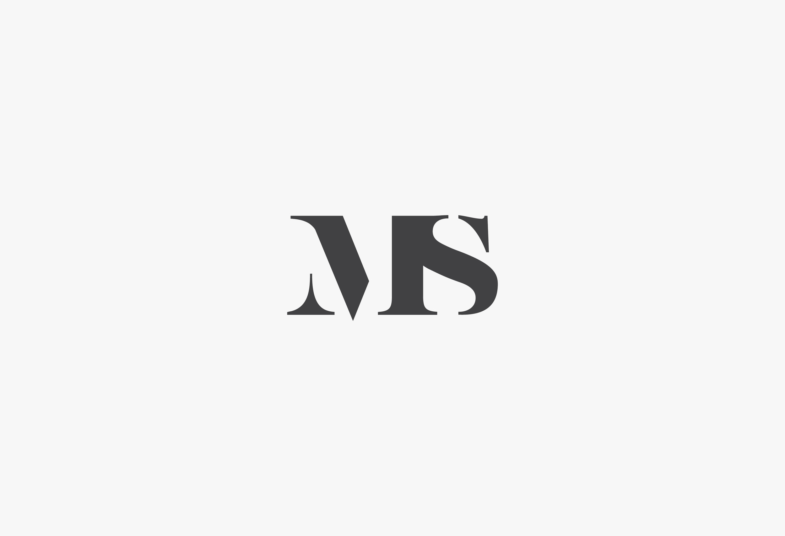 Identity design for photographer Mark Shaw. Mark shoots a distinctive natural photographic style and wanted a bold visual identity to stand him apart from the competition. Both within Cornwall and the wider South West region. The identity was formed from the linking of his initials, to simply convey what his photography captures — the joining of couples in marrige.