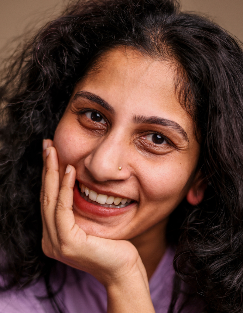 Photo of Devaki Rajendran smiling at the camera