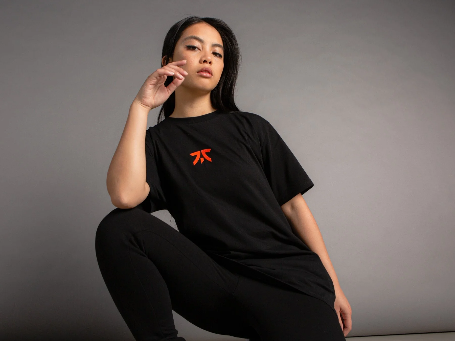 Streetwear fashion editorial featuring FNATIC apparel in studio