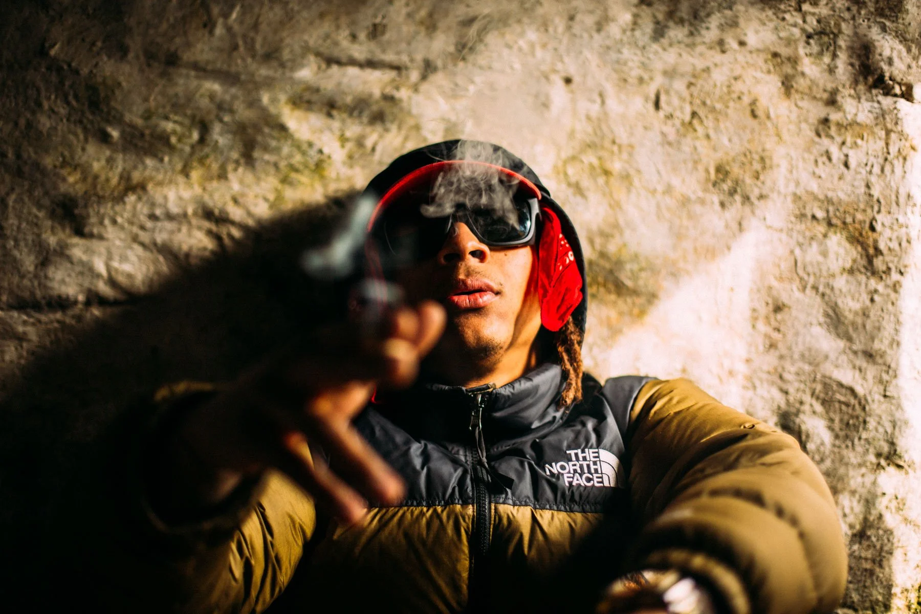 Tyler smoking inside a bothy in the Lake District