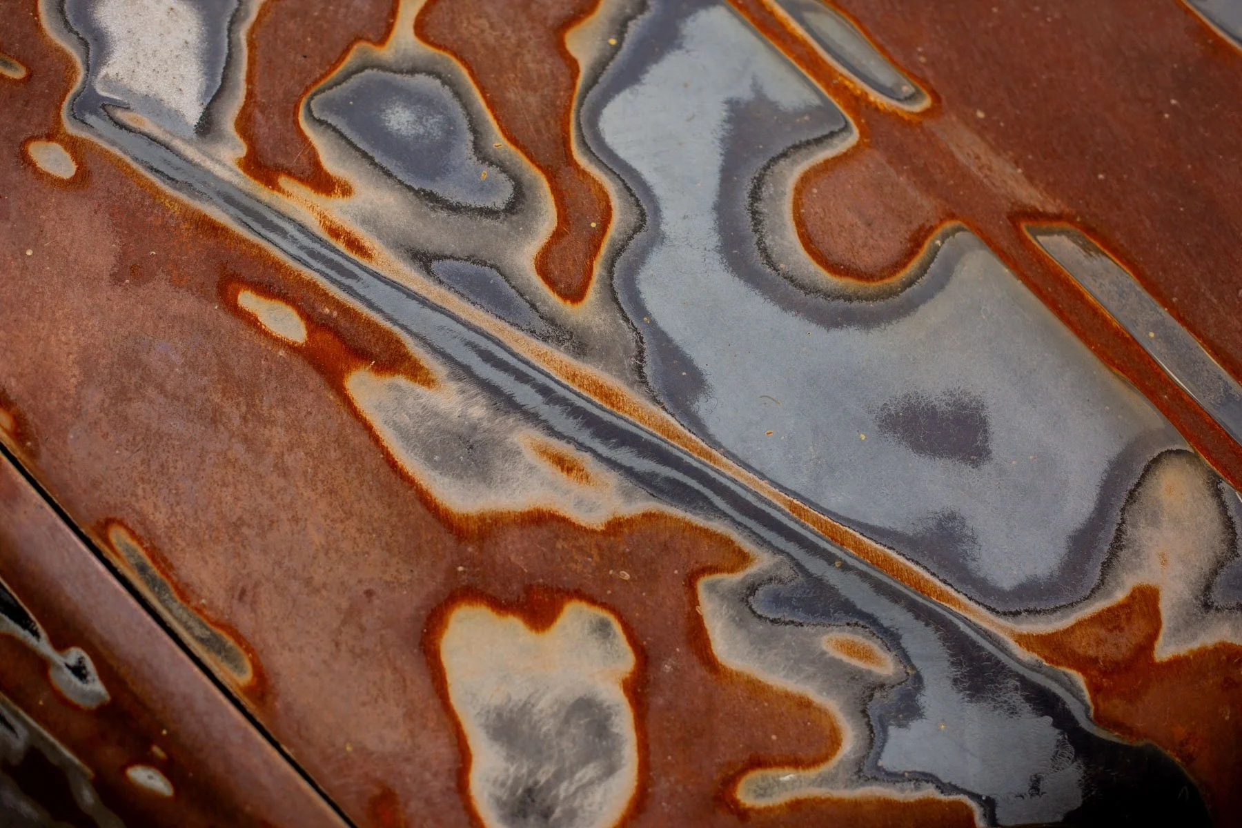 Patina and rust detail on car bonnet
