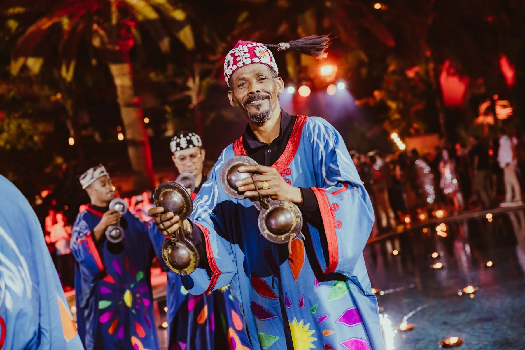 Traditional Moroccan performers on floating stage during live event