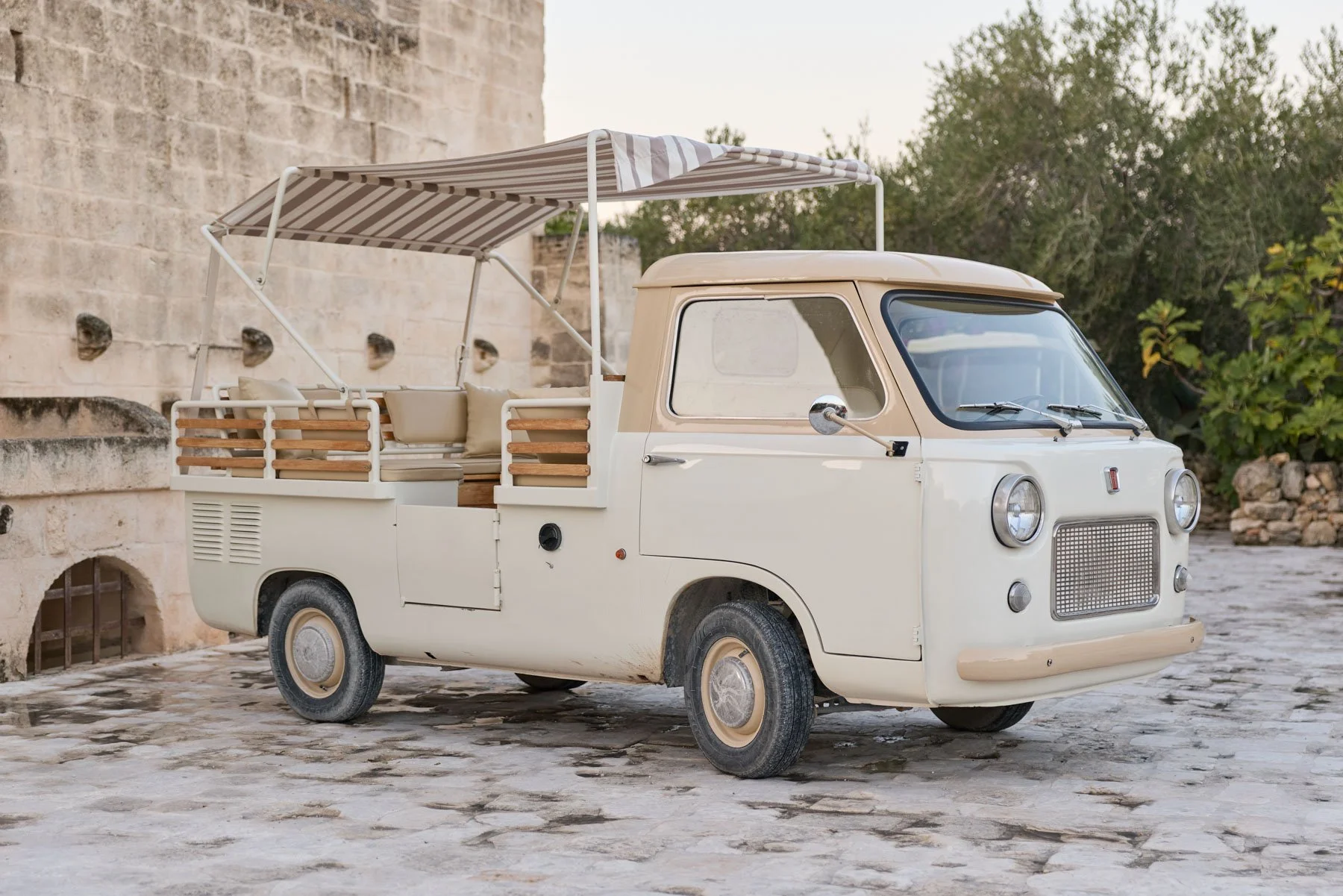 Guests viewing vintage Italian cars across event venue