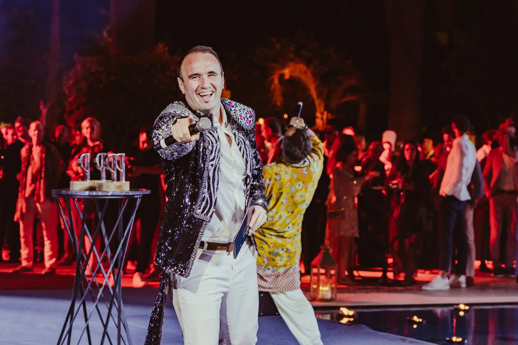 Event hosts on floating stage during live show