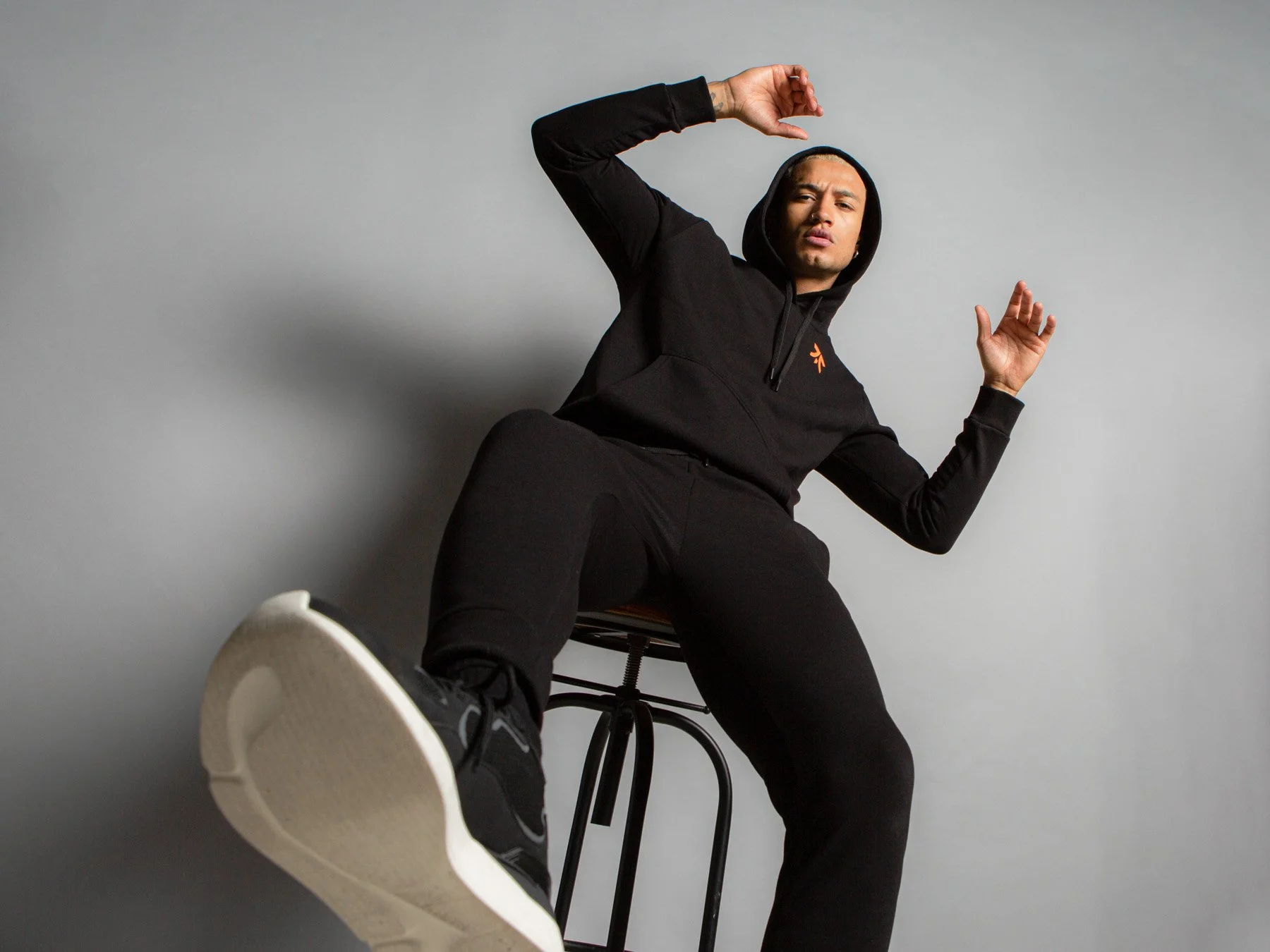 Contemporary studio fashion portrait featuring FNATIC apparel