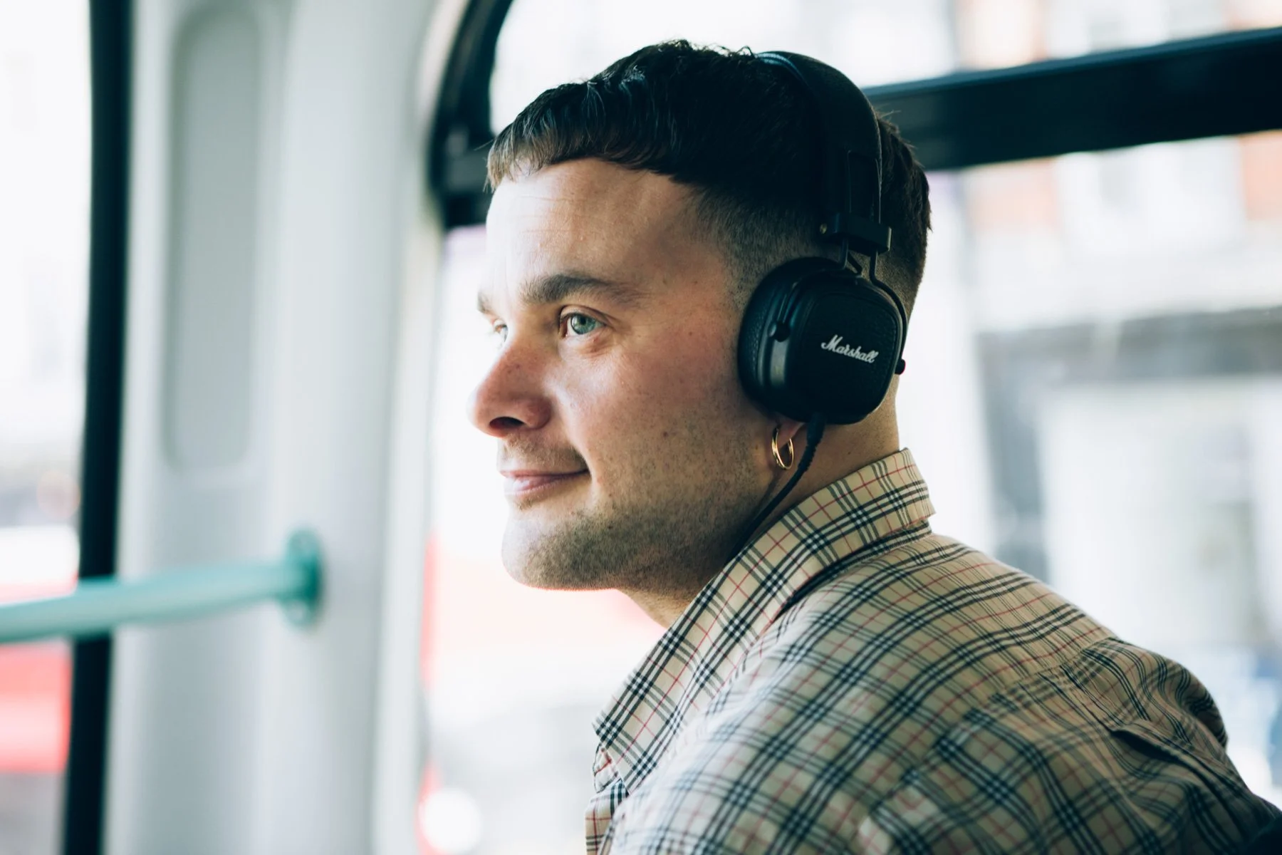 Commercial lifestyle photography of Isaac Holman wearing Marshall headphones