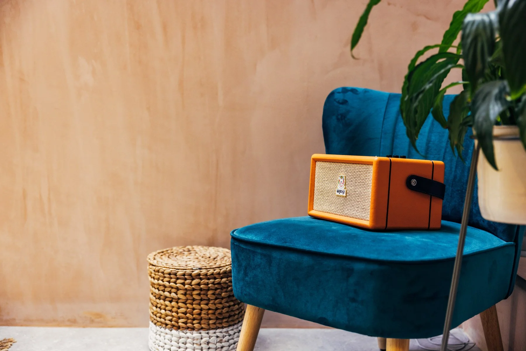 Advertising photography of orange speakers in styled setting