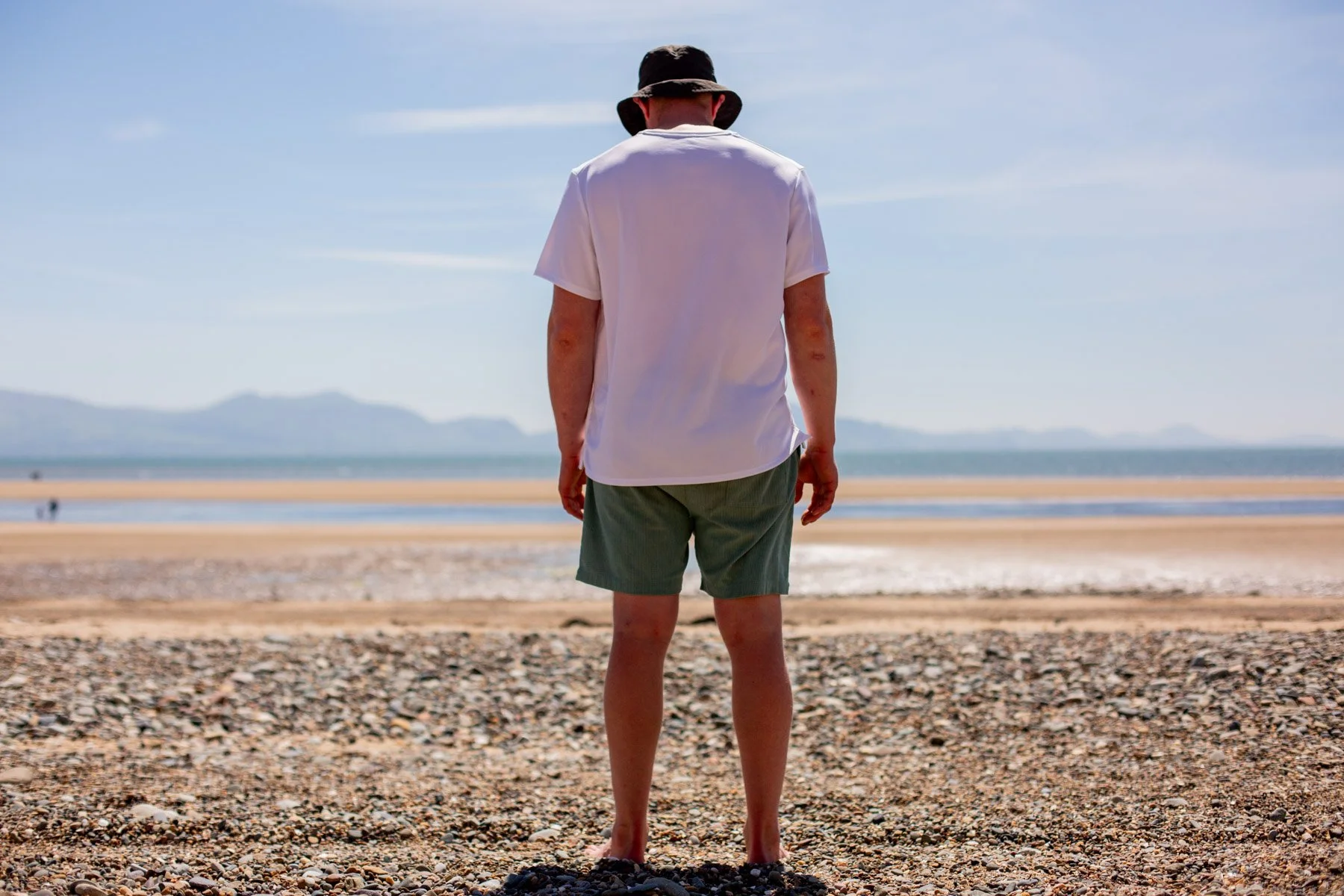 James standing on beach in Wales