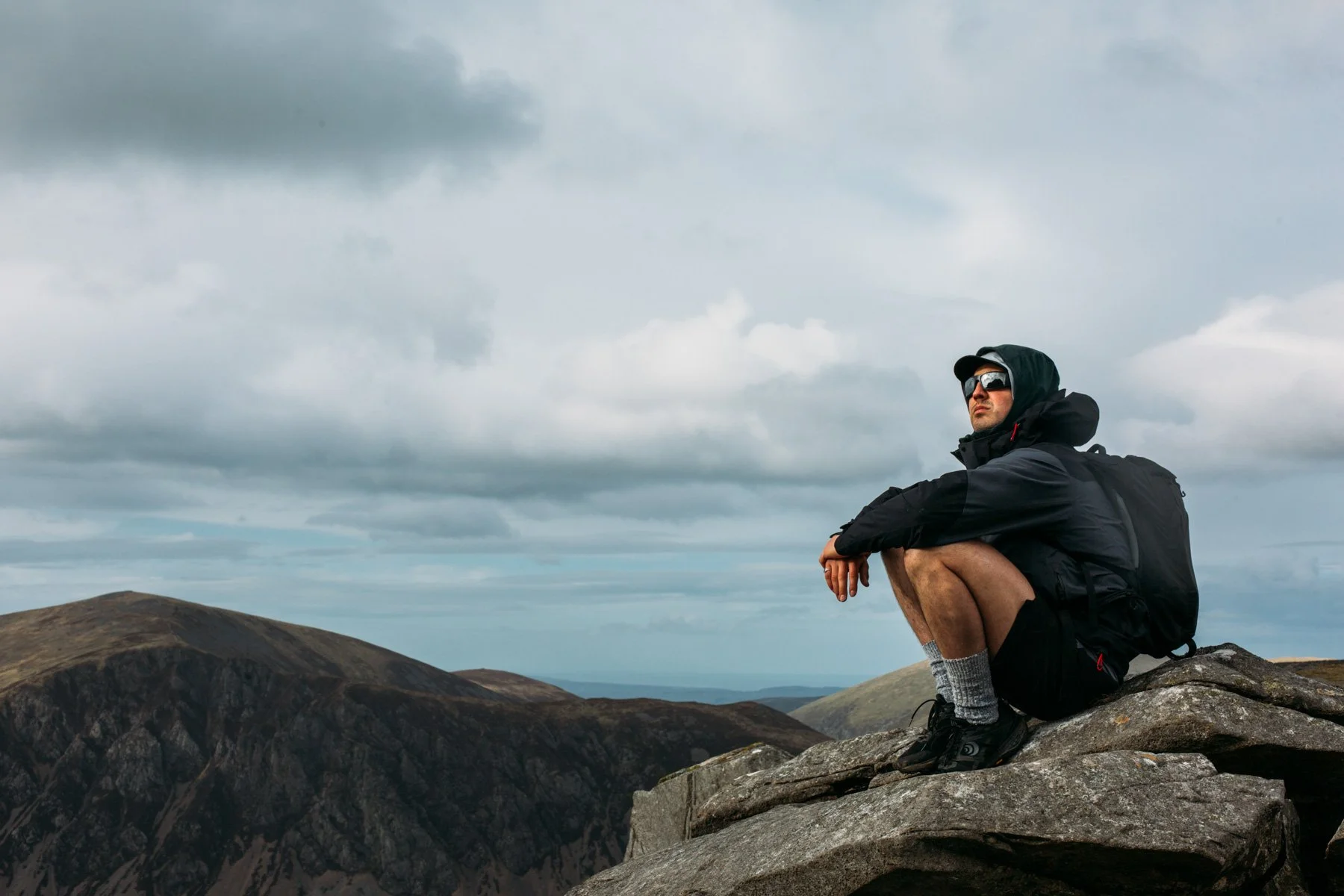 Austen sitting and overlooking Snowdonia landscape