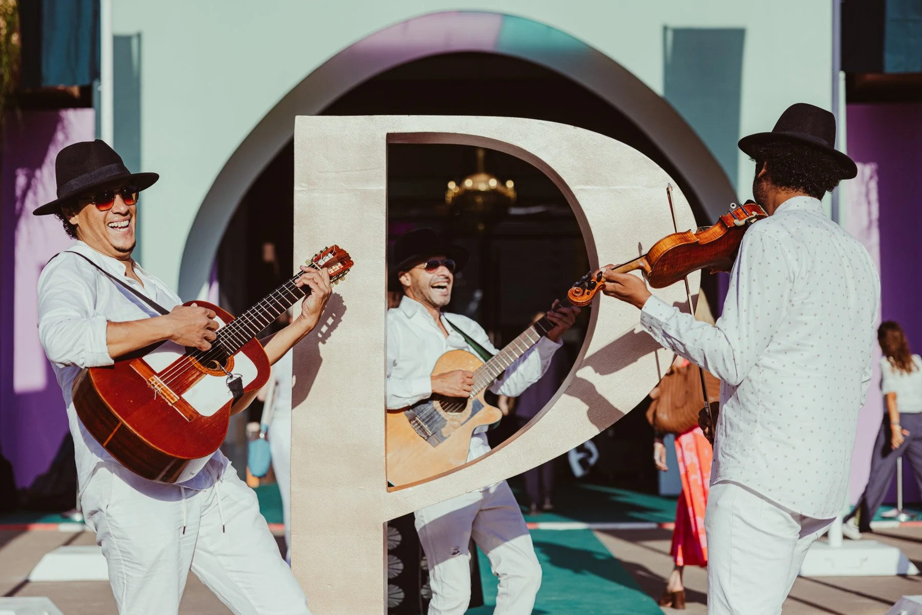 Three-piece acoustic group greeting guests on arrival