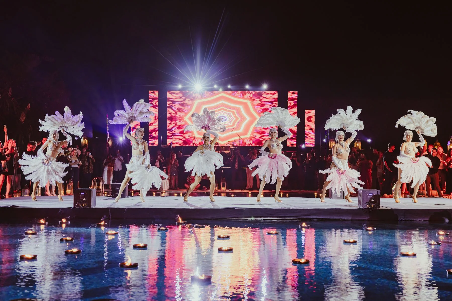Dancers performing on floating stage during live event
