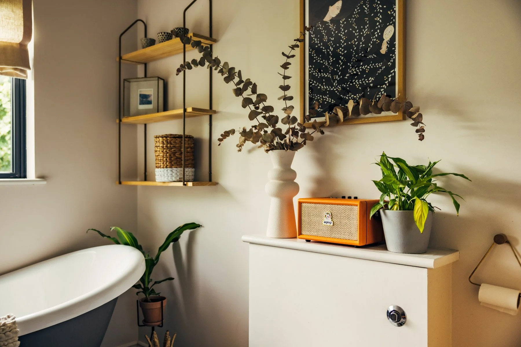 Advertising photography of orange speakers in styled setting