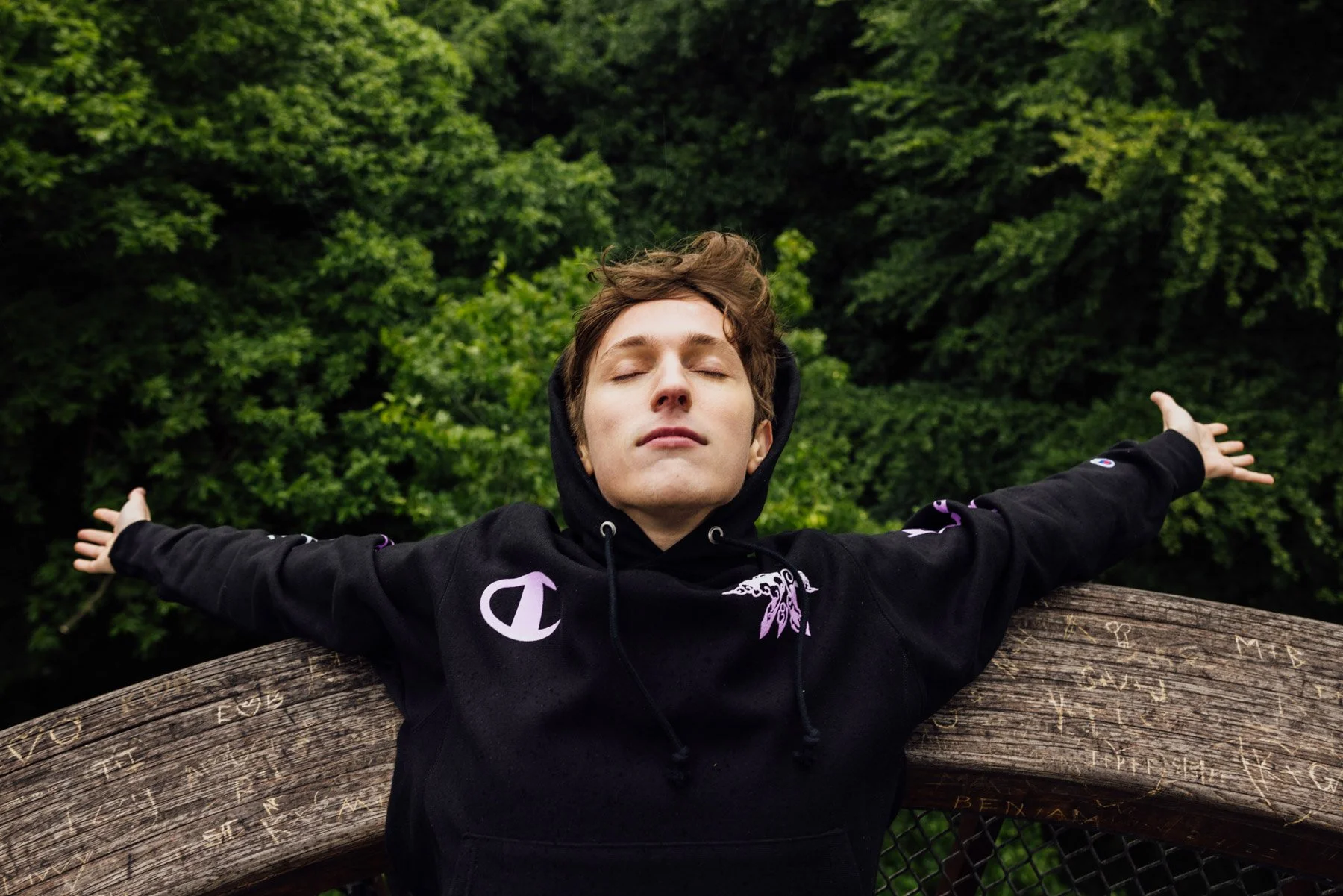 Lifestyle fashion portrait of Boaster in Kew Gardens wearing FNATIC street apparel