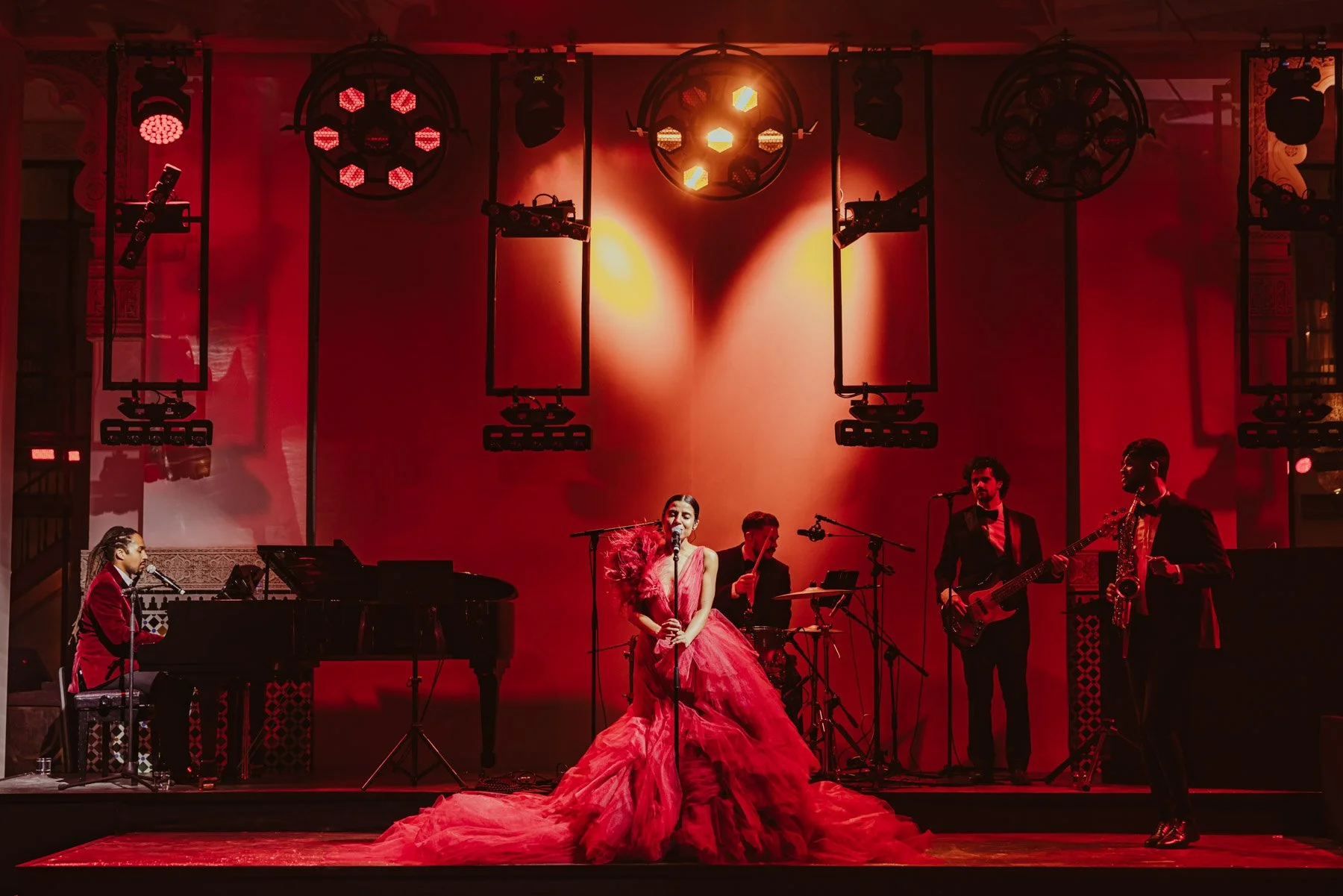 Performer on stage with live band