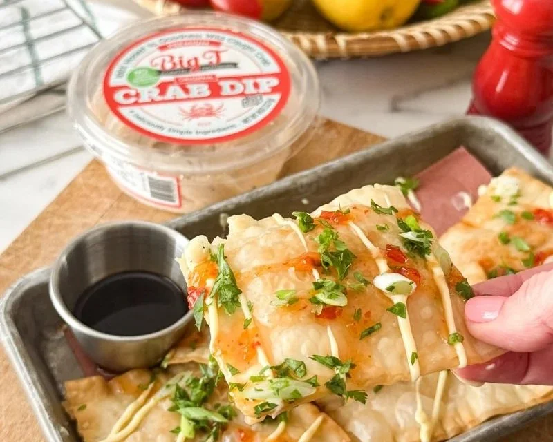 Crab Wontons made with Big T Crab Dip and drizzled with sweet chili sauce and kewpie mayo