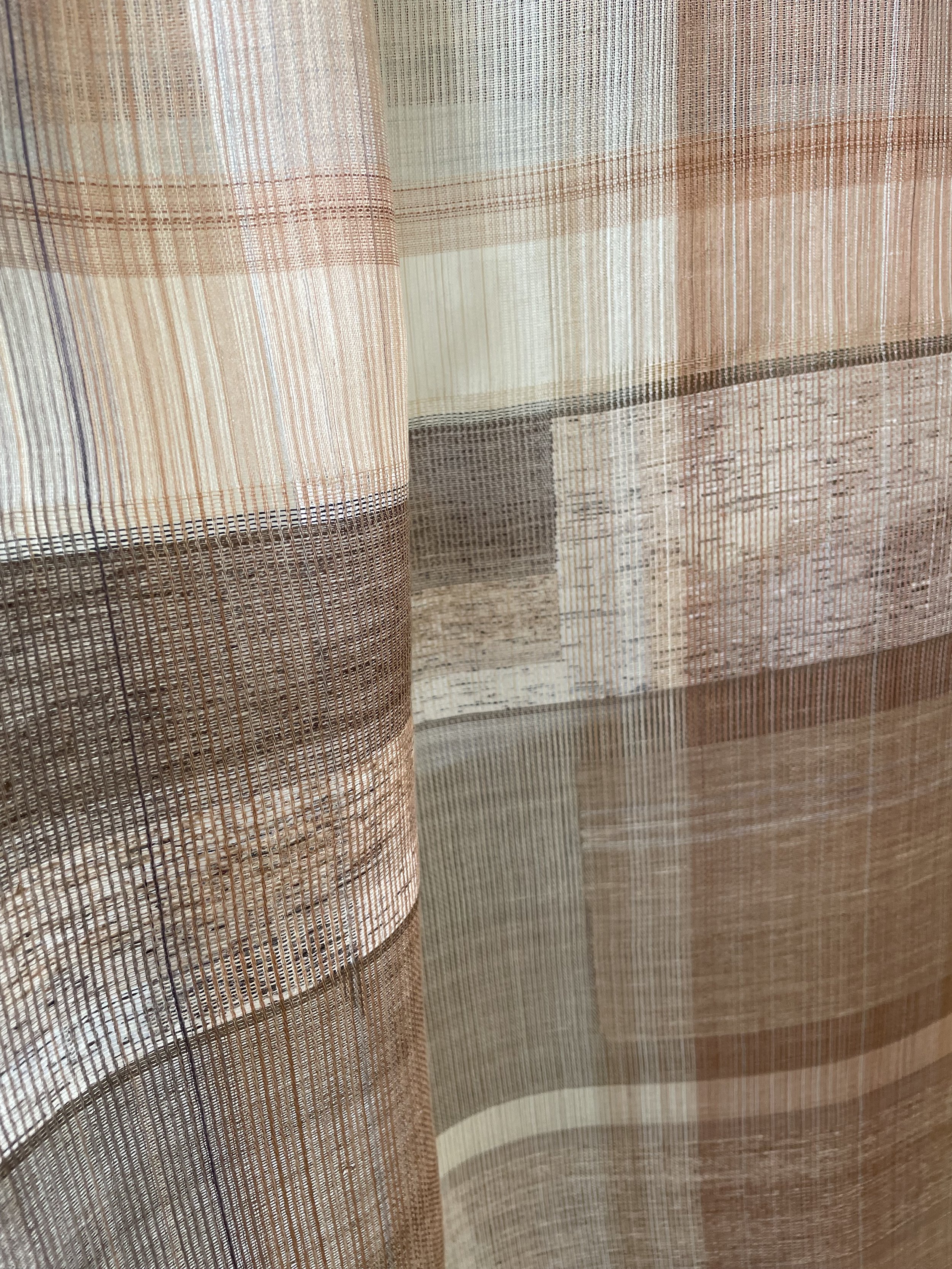  Accoustic panel with bespoke handwoven textile made from silk and handmade paper yarn, 2025. 60 × 120 cm. Handmade natural colour from plant pigments including logwood, cutch, persimmon, birch bark and coreopsis. 