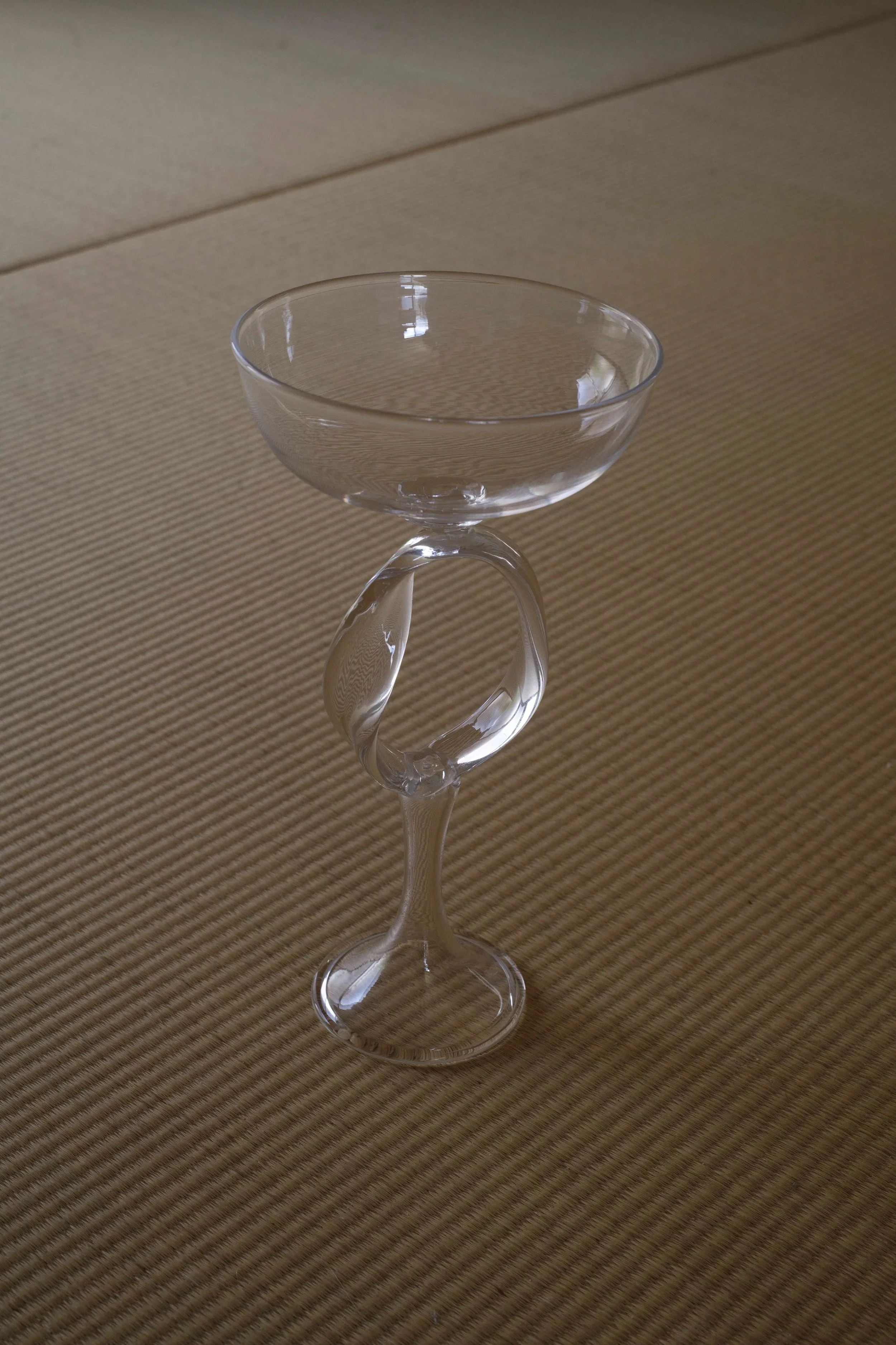   Summary of Material and Space (Möbius Cup) , blown glass  Looked through as much as it’s looked at, the inside  and outside of glass are visually the same side. A Möbius strip also has only one side.  