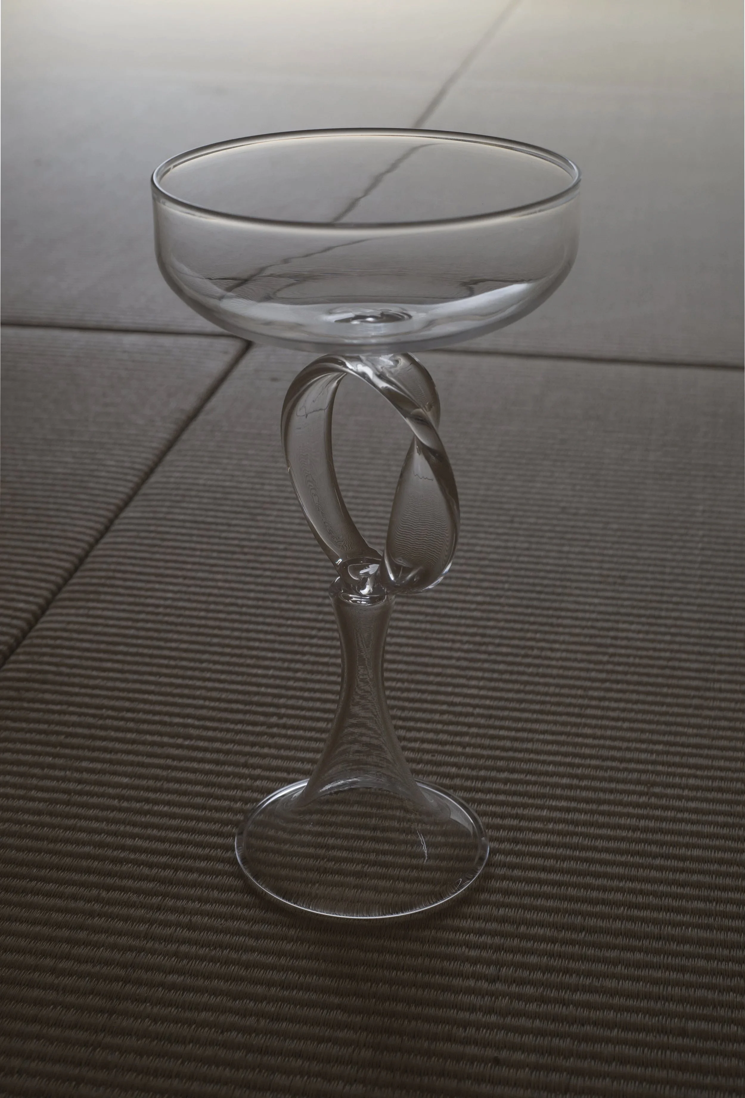  Summary of Material and Space (Möbius Cup) , blown glass  Looked through as much as it’s looked at, the inside  and outside of glass are visually the same side. A Möbius strip also has only one side.  