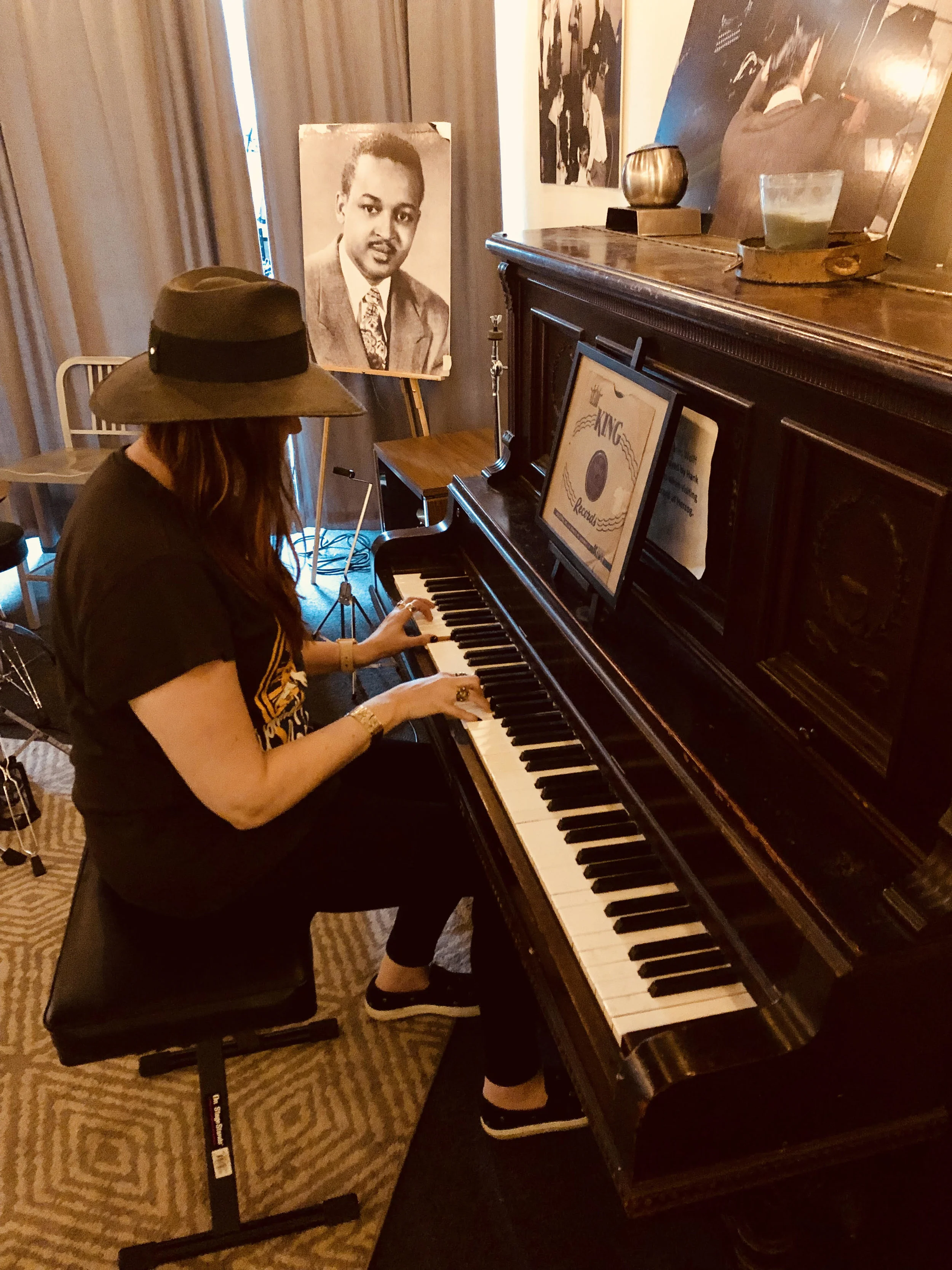 Hilary Williams at the same piano her grandfather likely used to work out arrangements