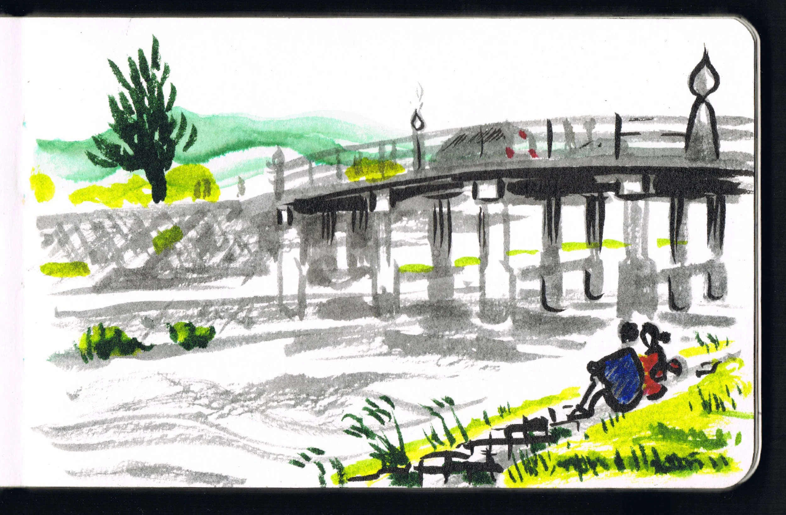 Couple sat by the Kamo River in Kyoto