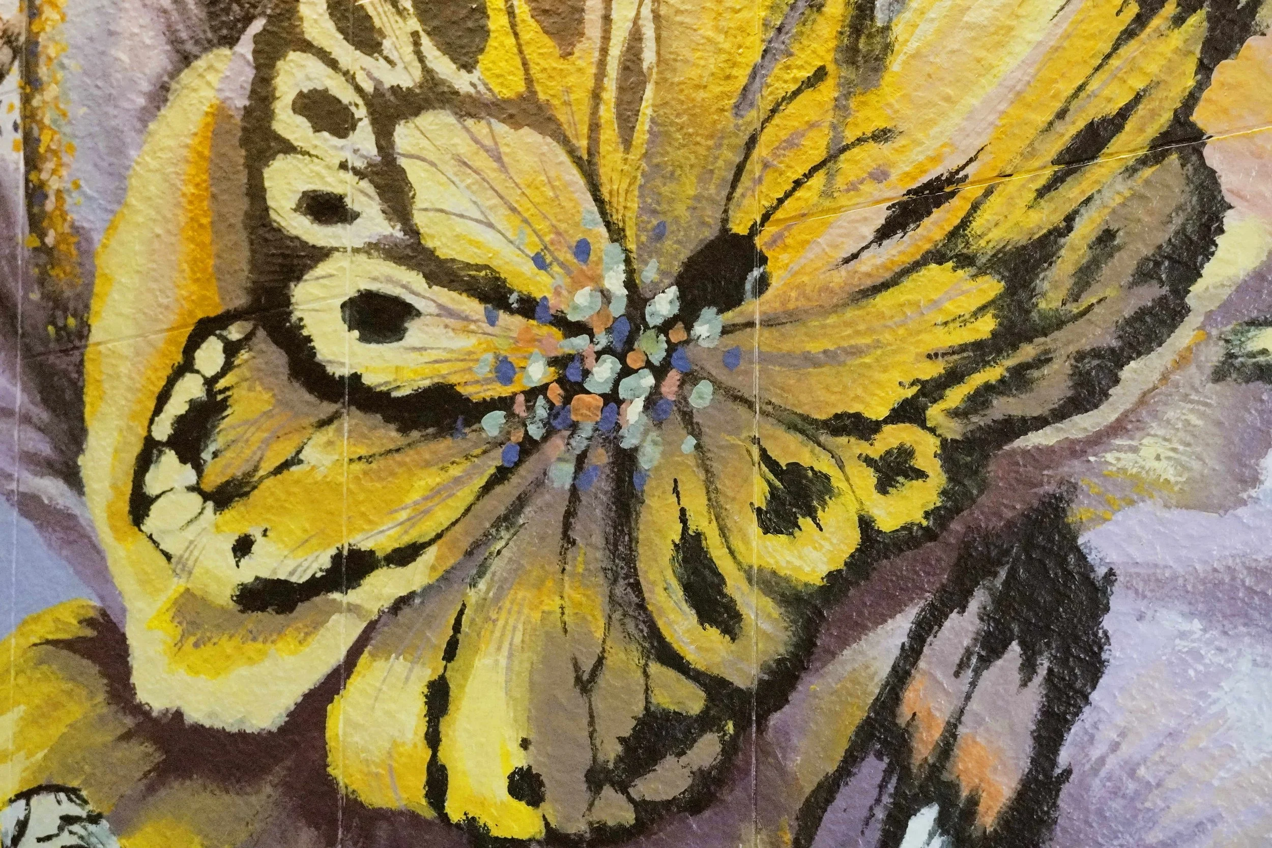 A mural created and painted by artist Neil Wang features a close-up of a flower-like, whimsical yellow butterfly in Novoland Hong Kong by Sun Hung Kai Properties.