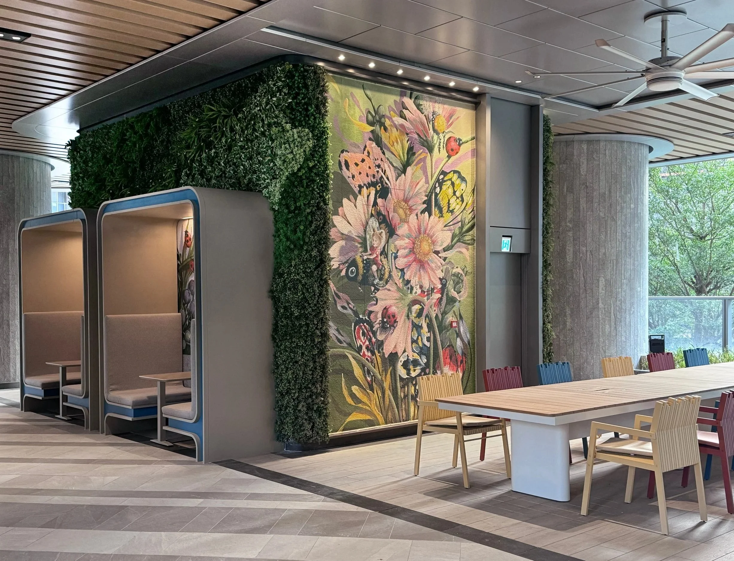 Residential estate mural created and painted by artist Neil Wang featuring bright colored nature plants, flowers, bold and whimsical ladybirds and butterflies, in Novoland Hong Kong by Sun Hung Kai Properties.