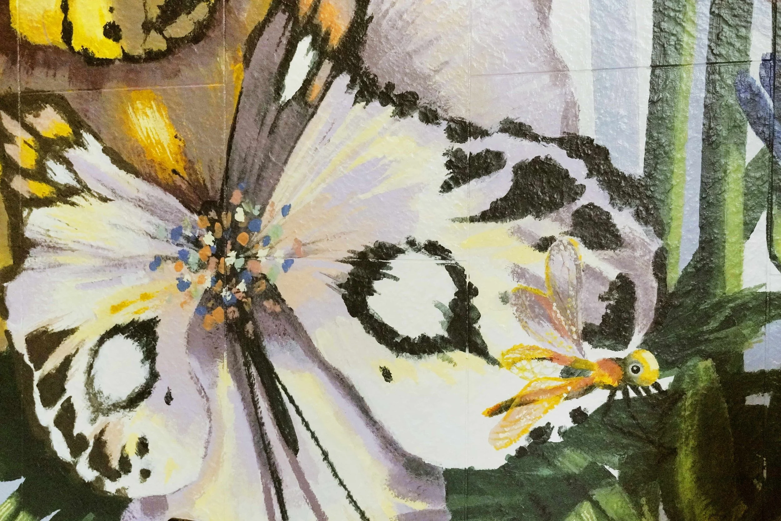 A mural created and painted by artist Neil Wang features a close-up of a flower-like, whimsical butterfly and a small yellow dragonfly resting on a leaf, in Novoland Hong Kong by Sun Hung Kai Properties.