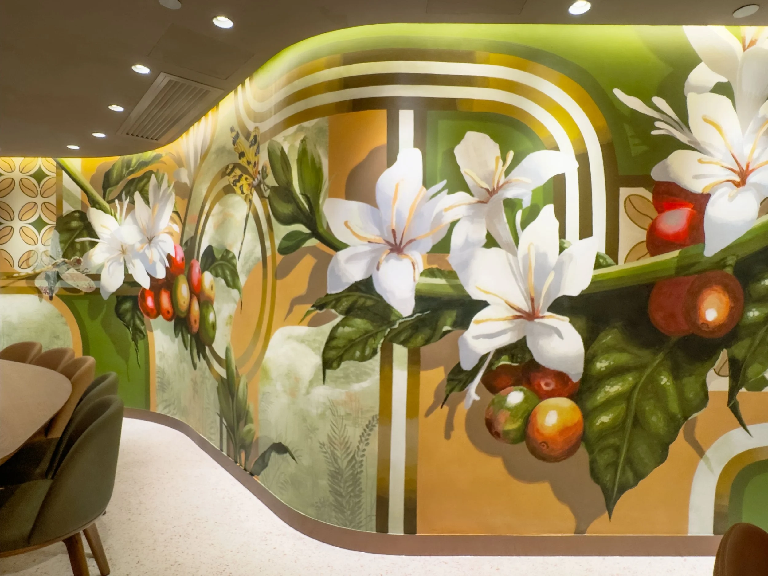 Mural painted by Neil Wand for Starbucks Reserve Landmark Central Hong Kong. Featuring enlarge coffee plants, cherries and coffee flowers. With oriental pattern and foggy oasis background in coral, olive green and gold hues.