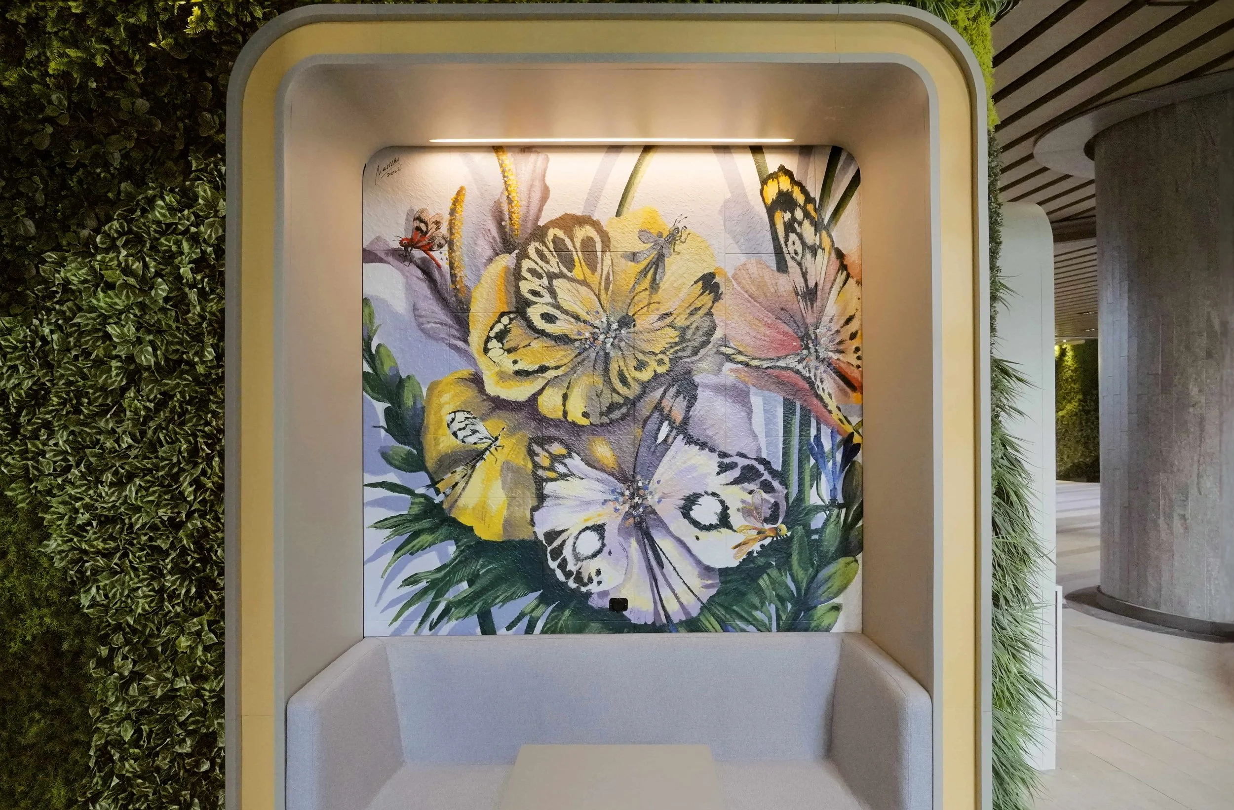 A mural created and painted by artist Neil Wang features flower-like giant butterflies and dragonflies in different colors, located in Novoland Hong Kong by Sun Hung Kai Properties.