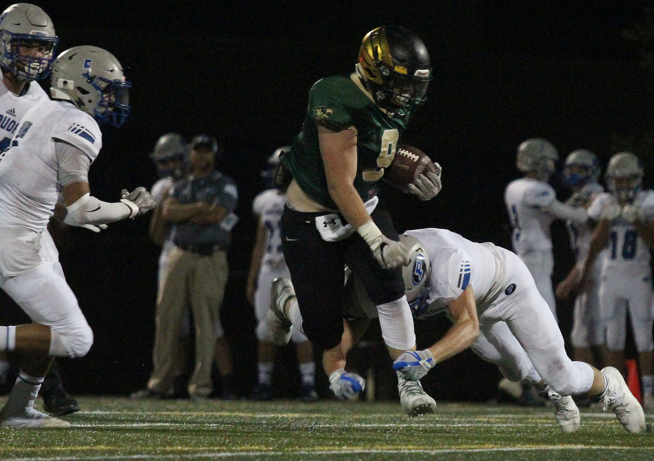 Senior Colton Whiteside carries the ball down the field in the first home football game of the season.