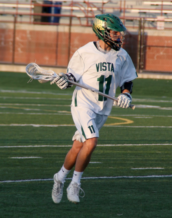 Senior Brad Oren cradles the ball in his last home game of his lacrosse career. 