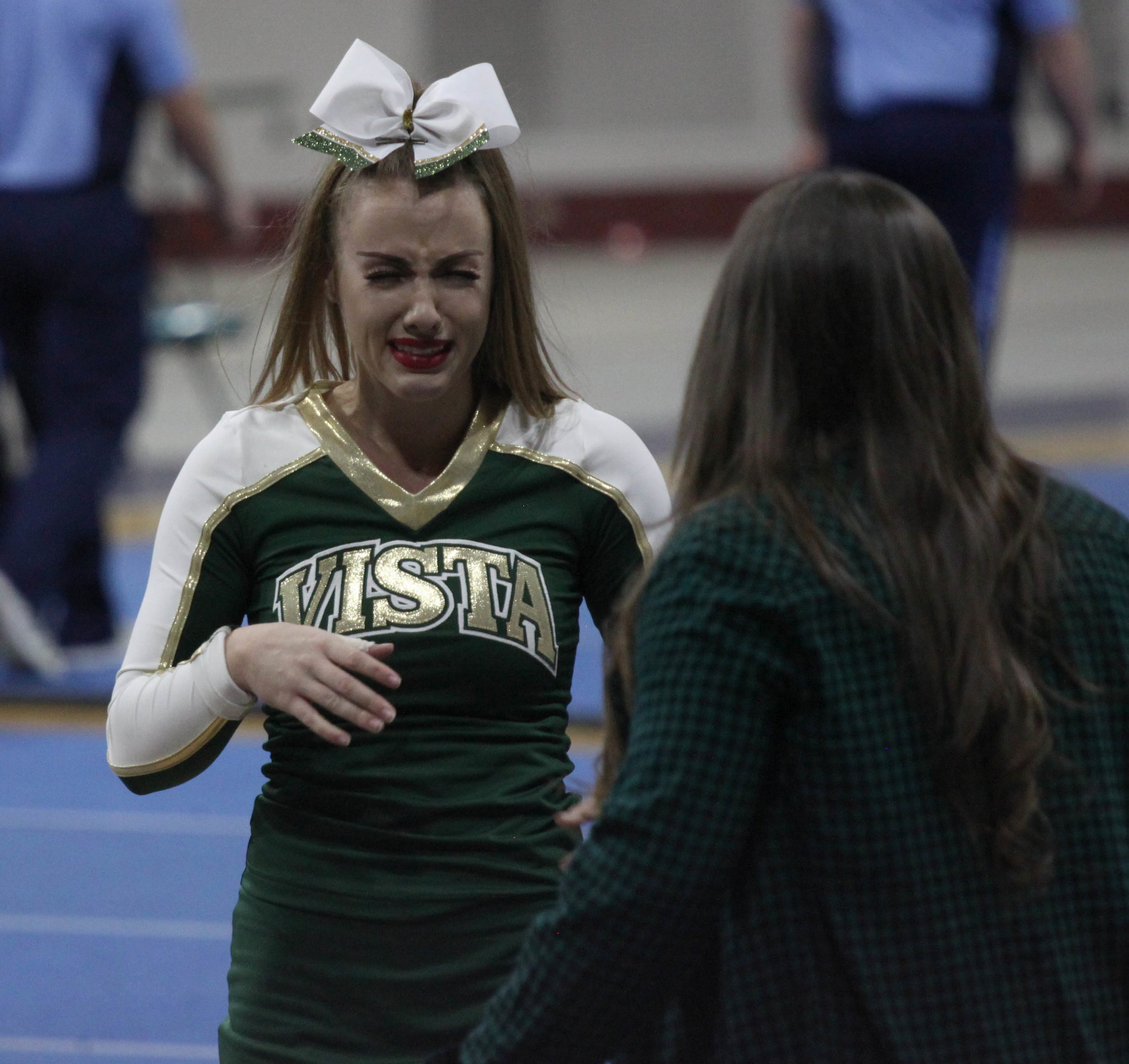 Senior Cailey McDaniel cries after her last high school cheer competition. 