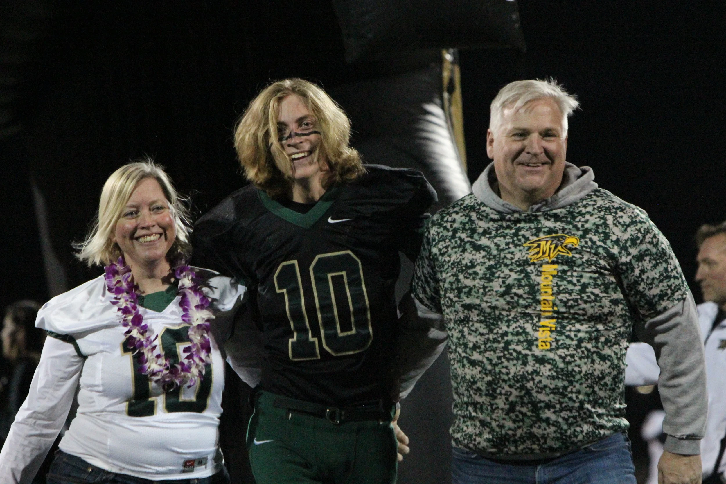  Senior Chase Mackey walks through the tunnel celebrating his career in high school football.&nbsp; 
