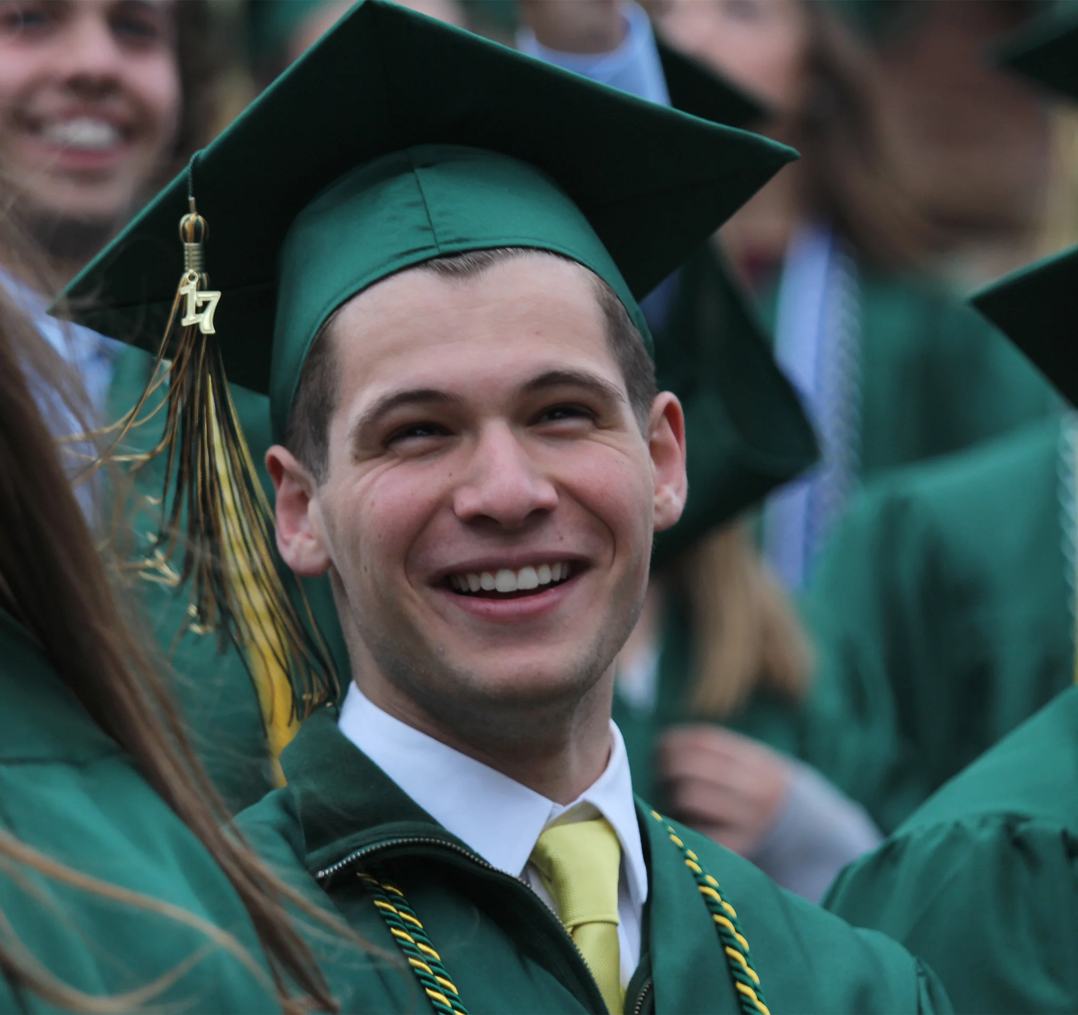 Senior Chase Phleuger reacts to speeches made at the 2017 Red Rocks graduation. 
