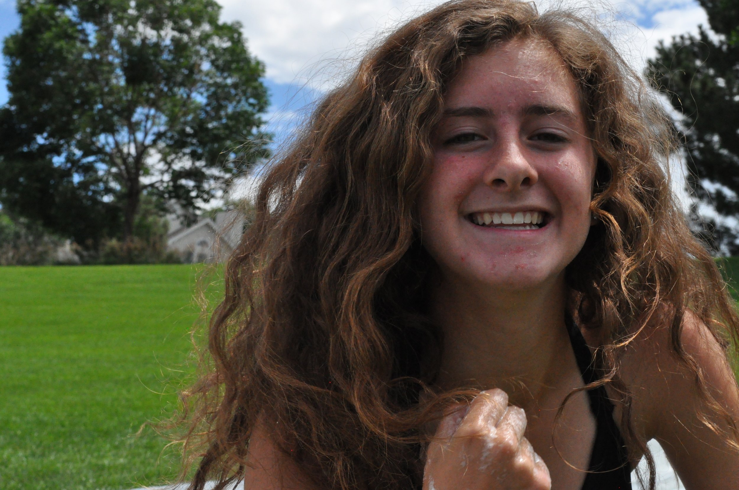  My good friend Avery smiles for the camera while sliding down a 100 foot homemade waterslide.&nbsp; 